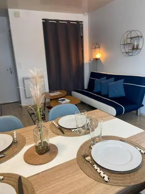 Coin salon dans l'établissement Le Saint-Amour appartement classé 2 étoiles