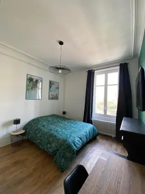 Un ou plusieurs lits dans un hébergement de l'établissement Le VH - Appartement 3 chambres