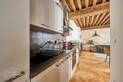 Cuisine ou kitchenette dans l'établissement Le Rousseau - Appartement & Suite en Hypercentre