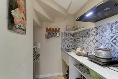Cuisine ou kitchenette dans l'établissement Le Petit Pressoir - Charmant studio