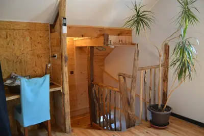 Un ou plusieurs lits dans un hébergement de l'établissement le p'tit studio au calme au pied du Jura