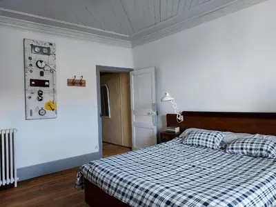 Un ou plusieurs lits dans un hébergement de l'établissement Chambre indépendante dans le moulin