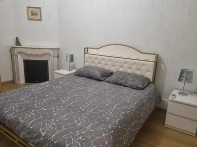 Un ou plusieurs lits dans un hébergement de l'établissement Appartement au cœur de la ville