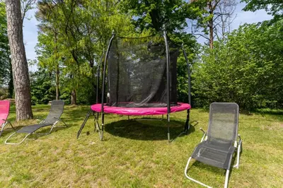 Jardin de l'établissement Gite 2 pièces Parc des Chamois piscine chauffée