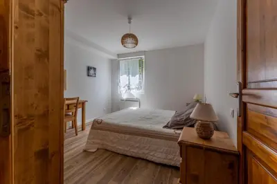 Un ou plusieurs lits dans un hébergement de l'établissement Gite Chateau 3 chambres piscine chauffée