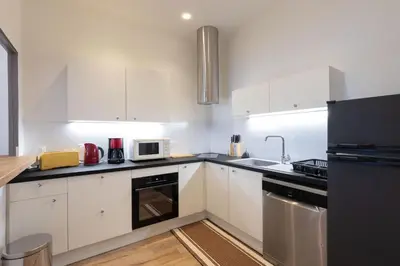Cuisine ou kitchenette dans l'établissement Les Joyaux Tournusiens