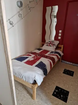Un ou plusieurs lits dans un hébergement de l'établissement Appartement Le Dauphin