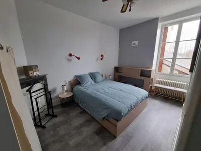 Un ou plusieurs lits dans un hébergement de l'établissement Grande Villa familiale et chaleureuse à Saulieu